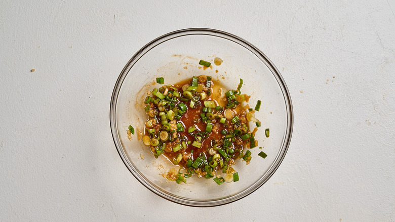 combining marinade ingredients in a bowl
