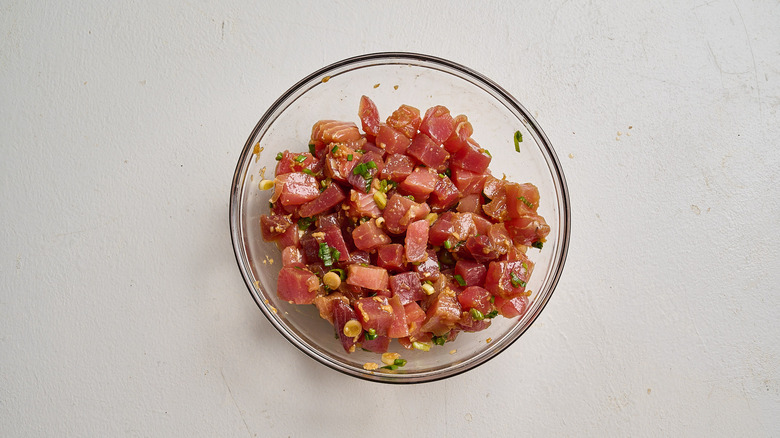 marinating tuna in a bowl