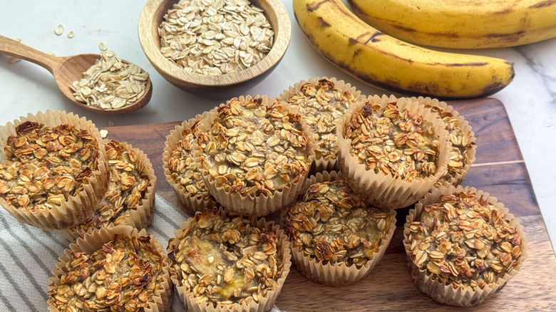 Banana oatmeal muffins on wooden serving board