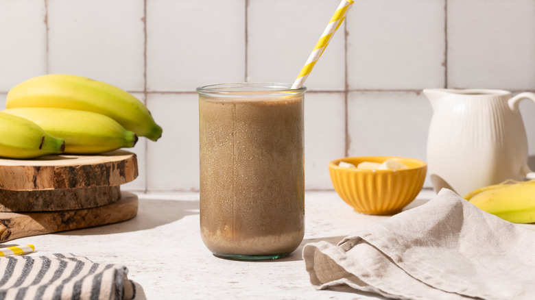 Frozen banana mocha in glass with straw