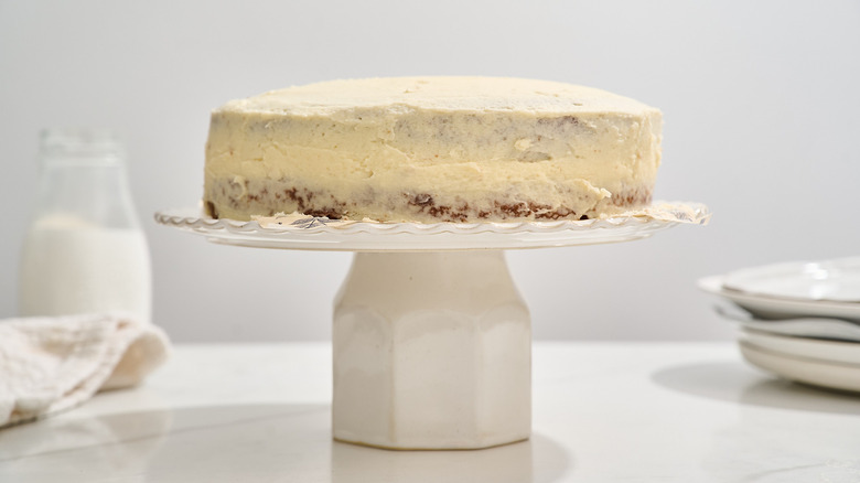 frosted cake on a cake stand