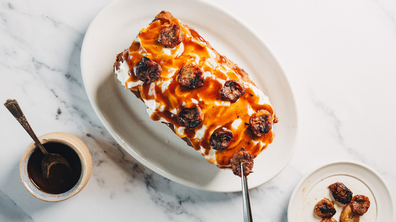 Overhead view of bourbon banana bread with caramel sauce.