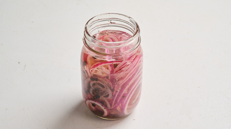 pickling liquid poured over onions