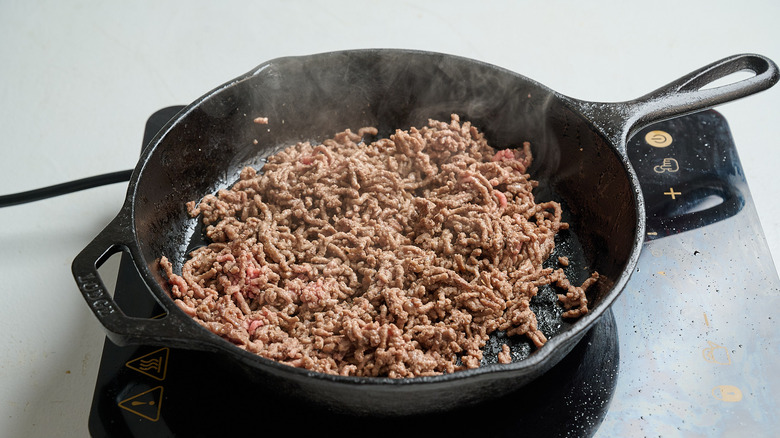 crumbling beef in a skillet
