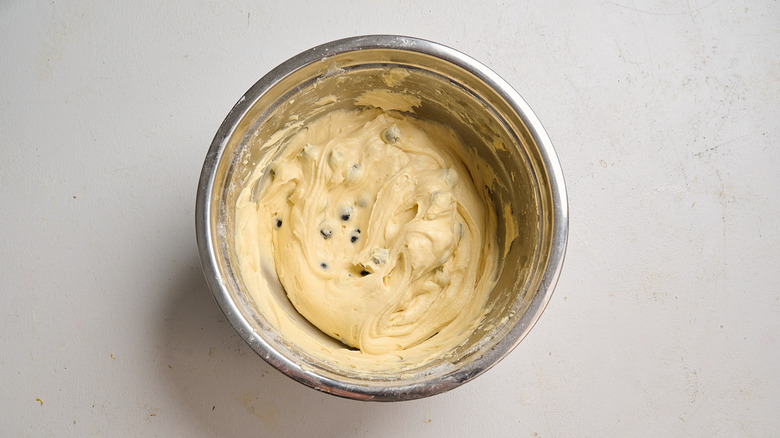 blueberries and lemon stirred into batter