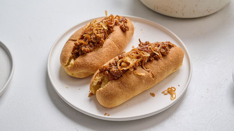 assembling hot dogs on a plate