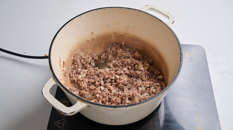 softening onions into the browned bison