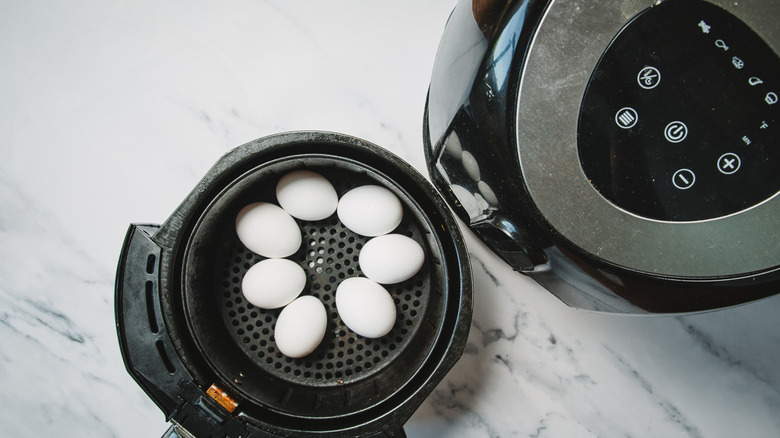 Eggs in air fryer basket.