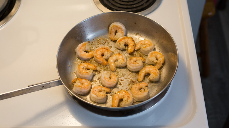 shrimp cooking in frying pan