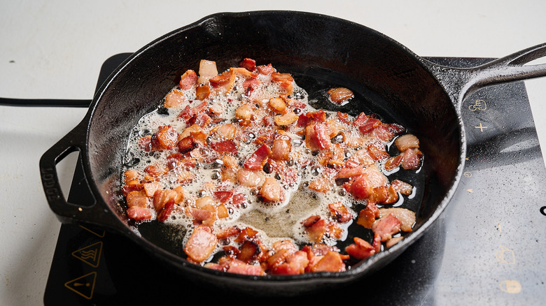 cooking bacon in a skillet
