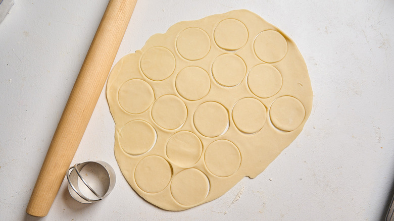 Mini crusts cut from dough with biscuit cutter