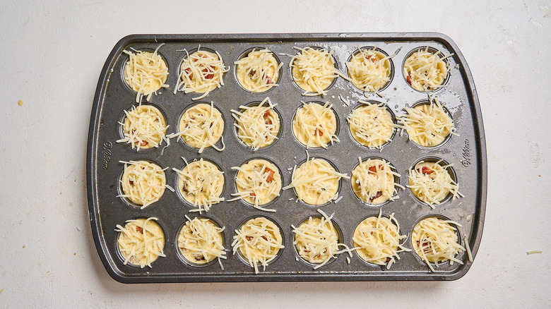 quiche cups filled with egg and topped with cheese