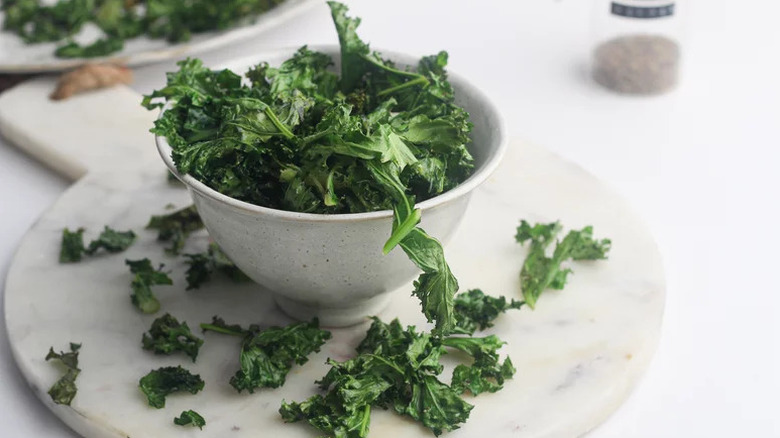 Air Fryer Kale Chips in small white bowl
