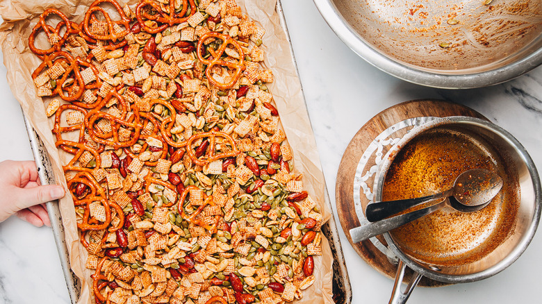 Snack mix on baking sheet.