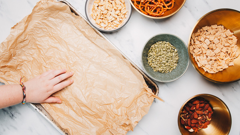 Prepping baking sheet.