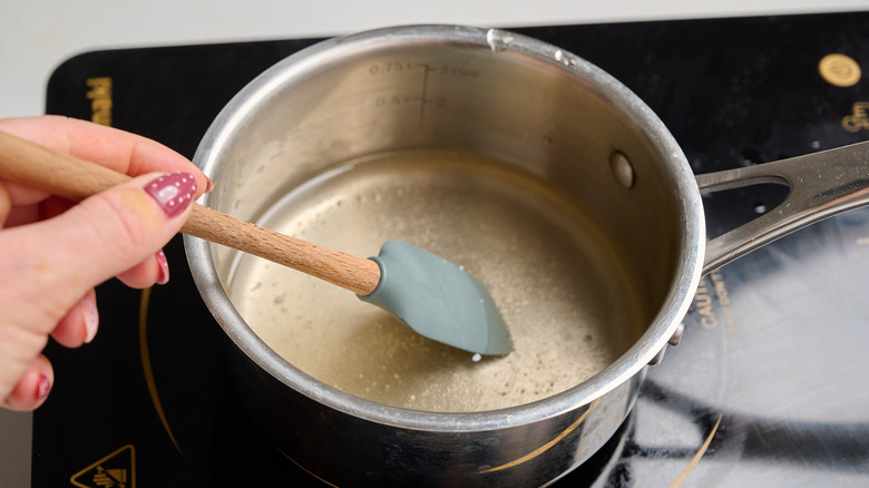 dissolving sugar in simmering water