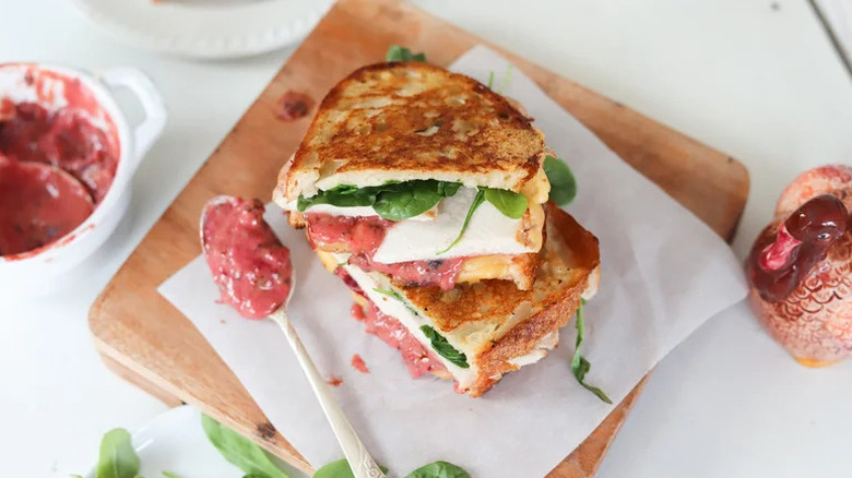 Turkey Panini with Chipotle Cranberry Spread on wooden board