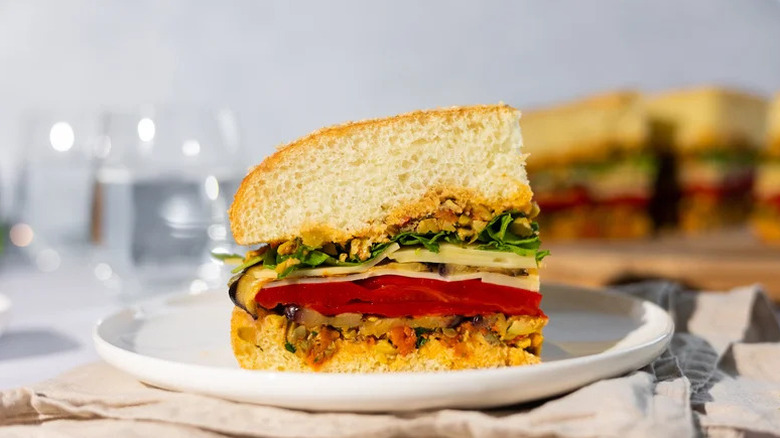 Slice of Vegetarian Eggplant Muffuletta on white plate