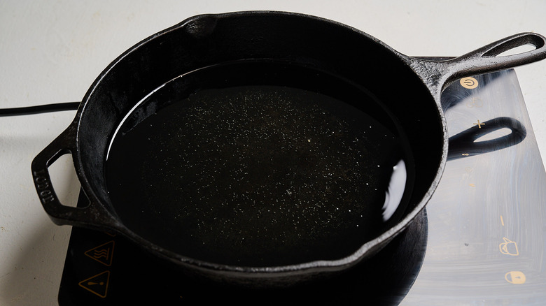 heating oil in a skillet