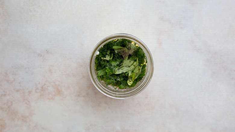 green herbs in Mason jar