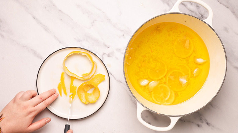 Slicing lemon peels.