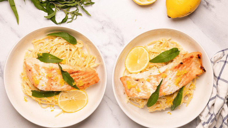 Two bowls of creamy citrusy salmon pasta.