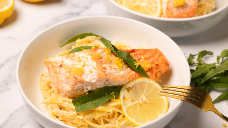 A bowl of creamy citrusy salmon pasta.