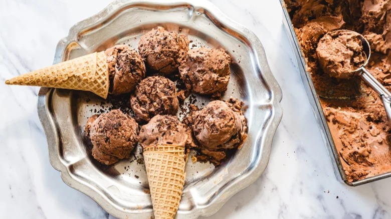 Silver tray with scoops of chocolate ice cream and cones