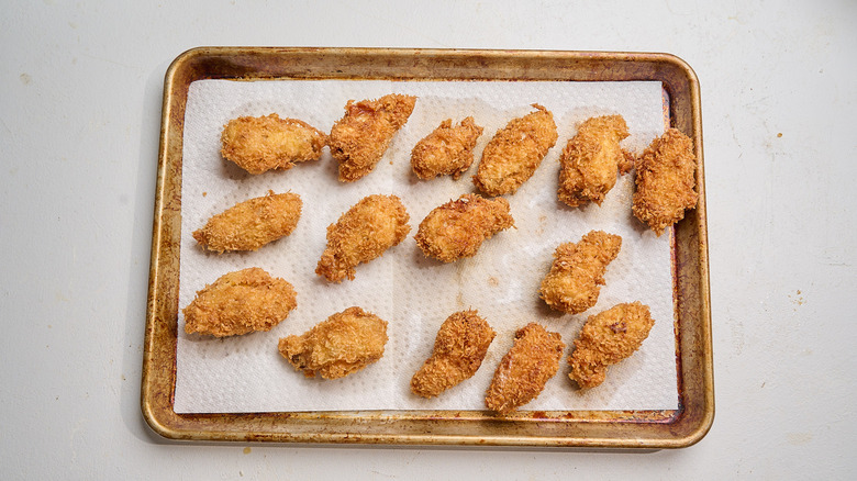 draining chicken on paper towels