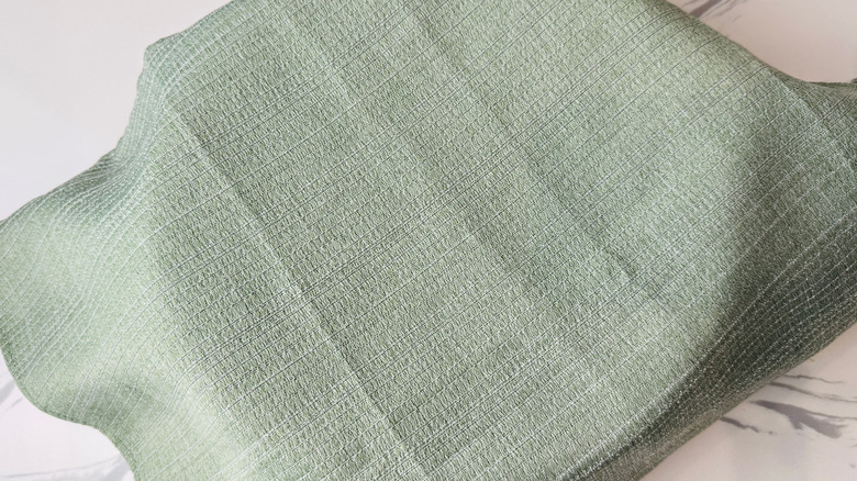 Bowl covered with kitchen towel