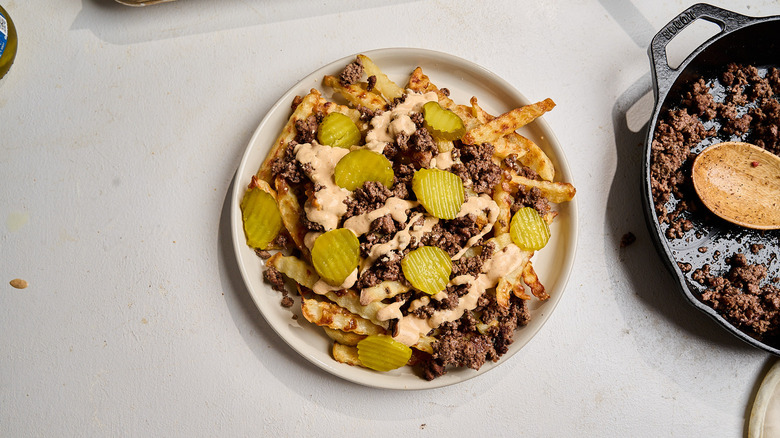 beef and fries topped with pickles
