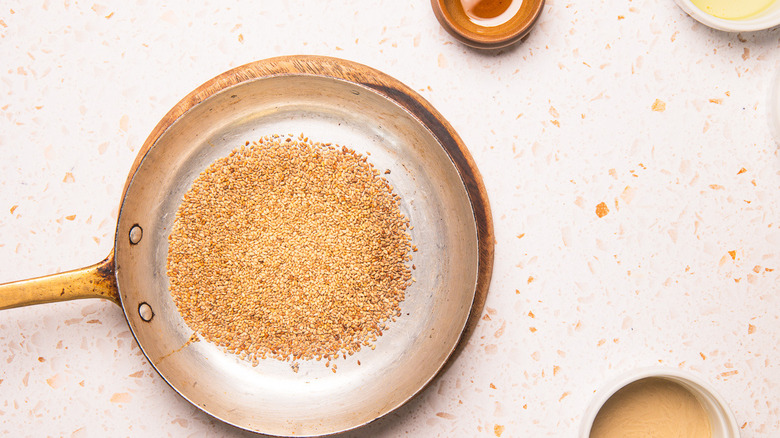 Toasted sesame seeds in pan.