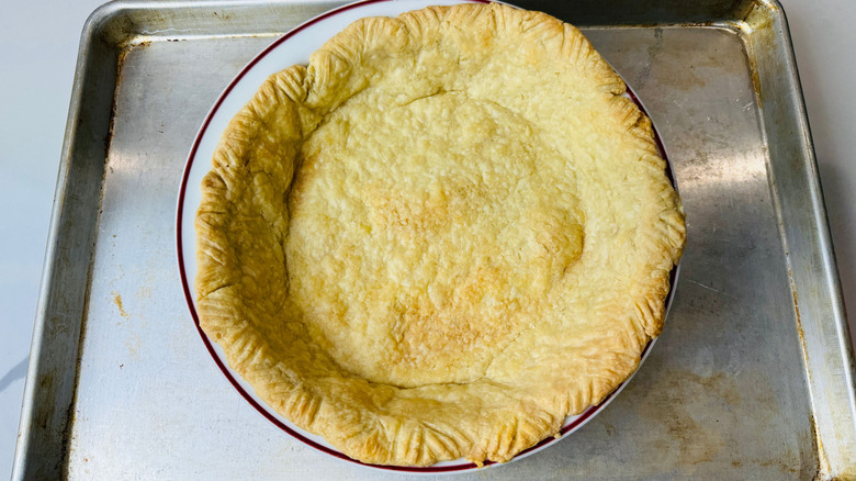 Baked pie crust on baking sheet