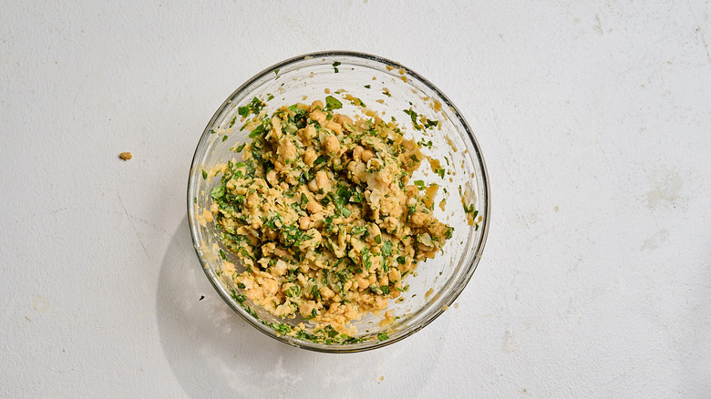 lemon and herbs mixed into chickpeas