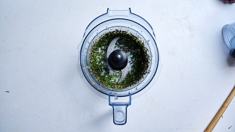 chopped parlsey and cilantro in a food processor