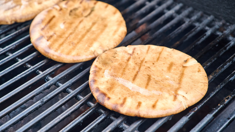  warming pita bread on grill grates