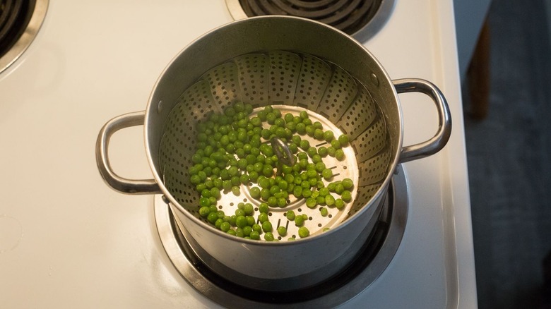 Peas in steamer basket