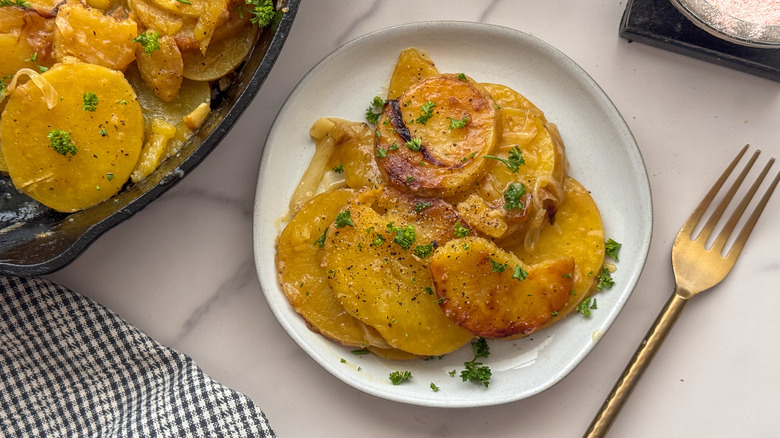 smothered potato serving on plate