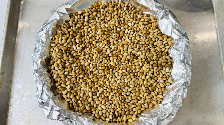 Pie crust lined with foil and filled with weights