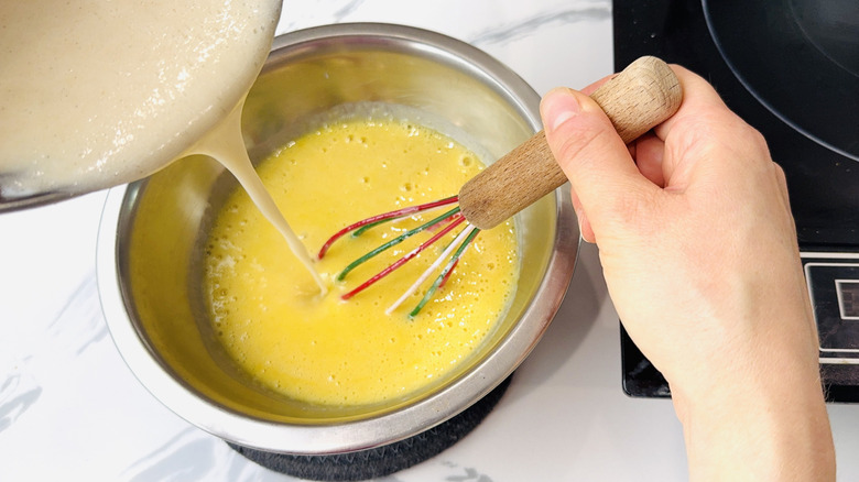 Tempering egg yolks in bowl