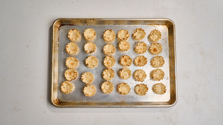 phyllo cups arranged on a baking sheet