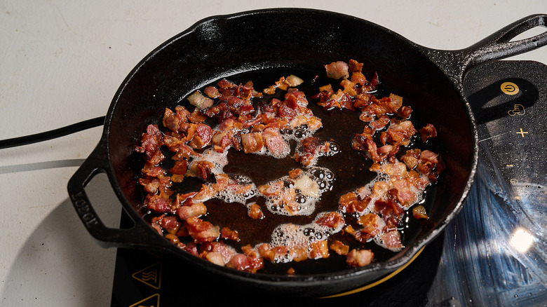 cooking bacon in a skillet