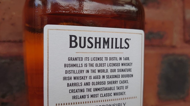 The back label of Bushmills Original detailing some of its history and production method