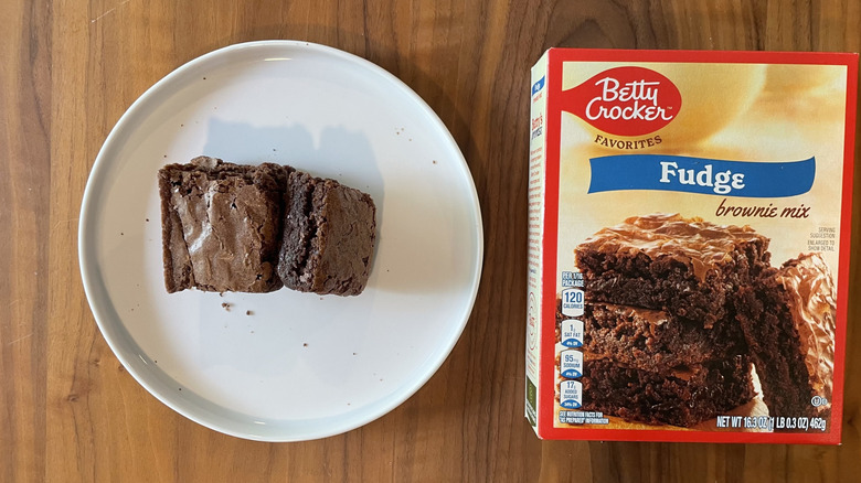 Betty Crocker brownie mix box and baked brownies on a plate