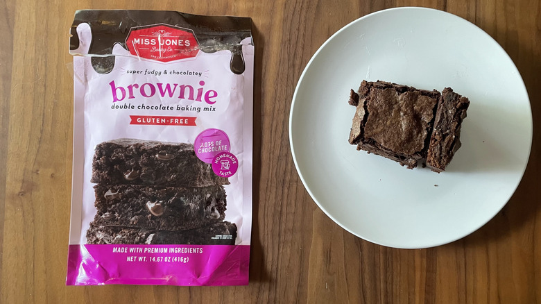 Miss Jones brownie mix box and baked brownies on a plate