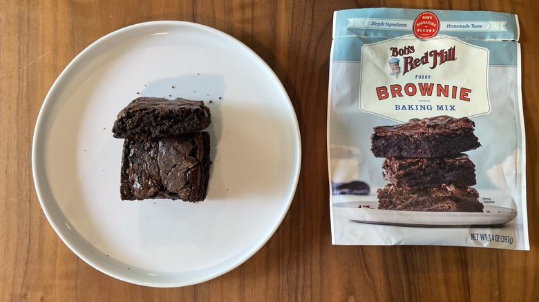 Bob's Red Mill brownie mix box and baked brownies on a plate