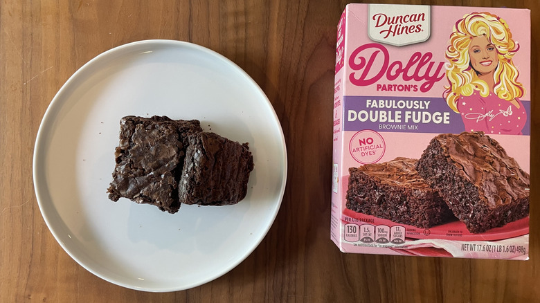 Dolly Parton's brownie mix box and baked brownies on a plate