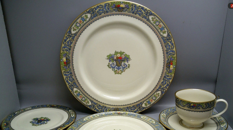 A set of Lenox Autumn dishes on display in a gray photography booth.