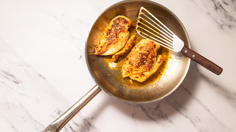 Cooked chicken in pan