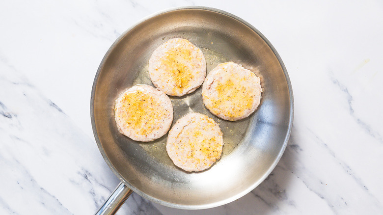 cooking patties in pan
